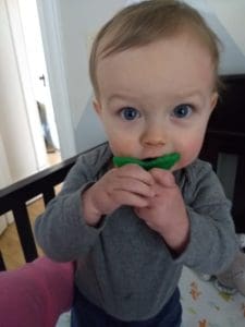 baby with berry buddy teether